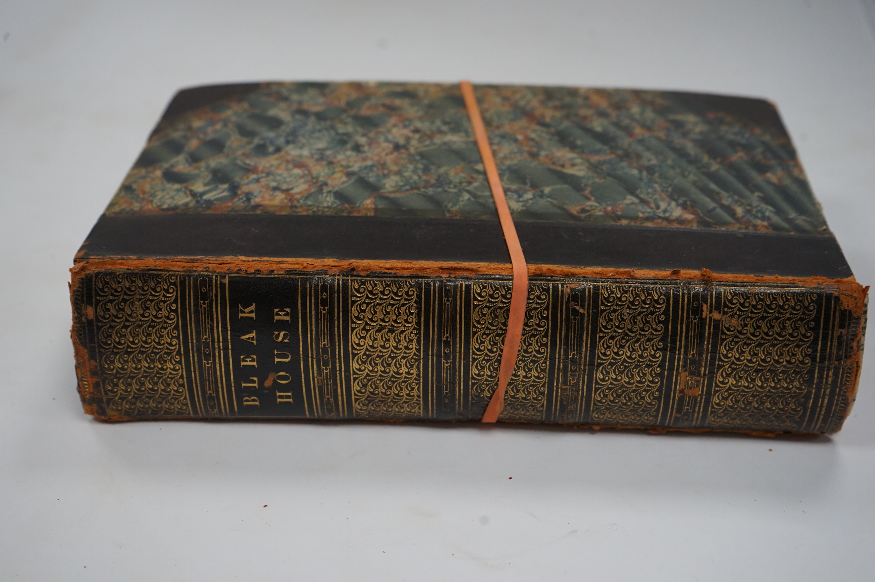 Dickens, Charles - Bleak House. First Edition. pictorial engraved and printed titles, frontis and 38 plates (by H.K. Browne); contemp. half calf and marbled boards (distressed), gilt decorated panelled spine and marbled